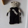 My girlfriend Vanessa also made this doll, this time for Adam.  It's dressed similarly to the way Adam used to dress while performing with one of his bands.  I suppose she anticipated the nail question because the piece of paper pinned to him says, 